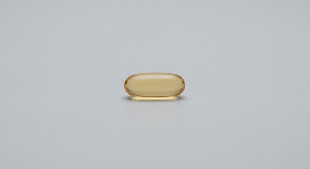 A single vitamin E softgel capsule